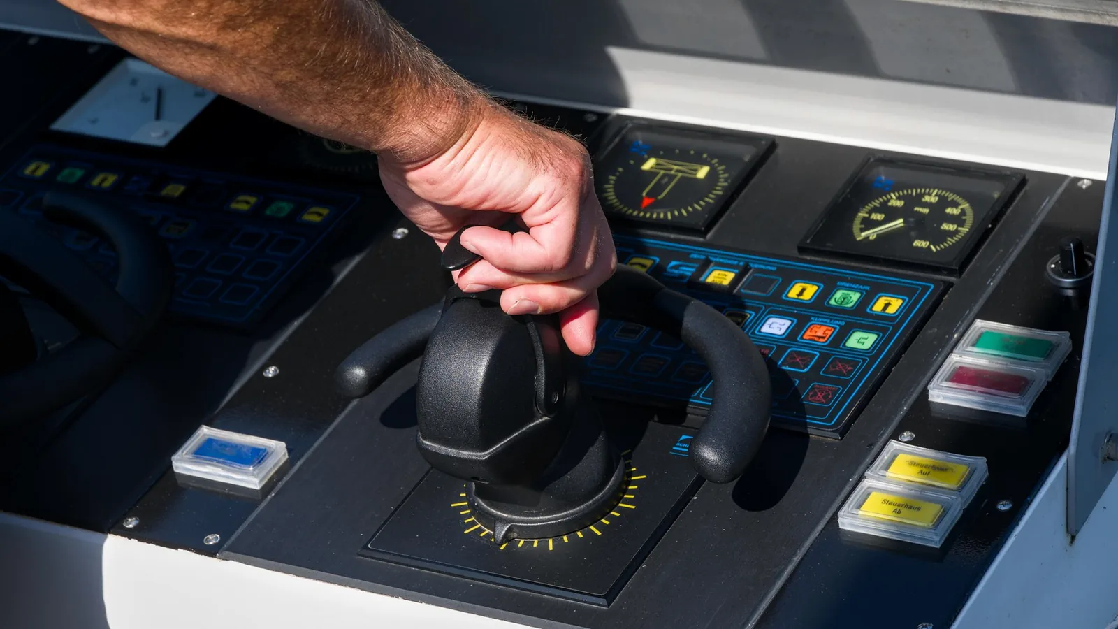 Operator using a marine vessel control panel
